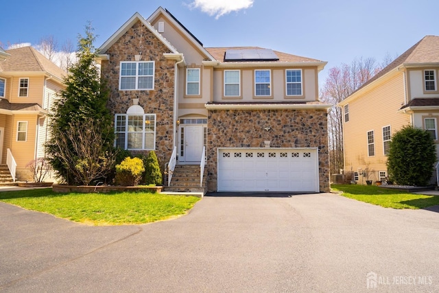460 Morning Glory Dr, Monroe, NJ 08831 - traditional-style home with stone siding, asphalt driveway, solar panels, and an attached garage