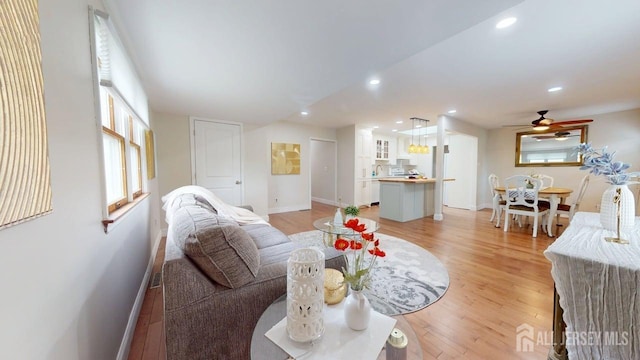 496 Calvert Rd, North Brunswick, NJ 08902 - living room with light wood-type flooring, ceiling fan, baseboards, and recessed lighting