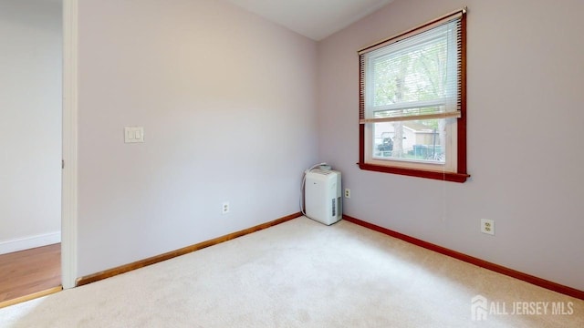 496 Calvert Rd, North Brunswick, NJ 08902 - carpeted empty room with baseboards