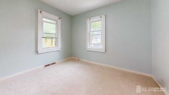 496 Calvert Rd, North Brunswick, NJ 08902 - empty room with carpet and baseboards
