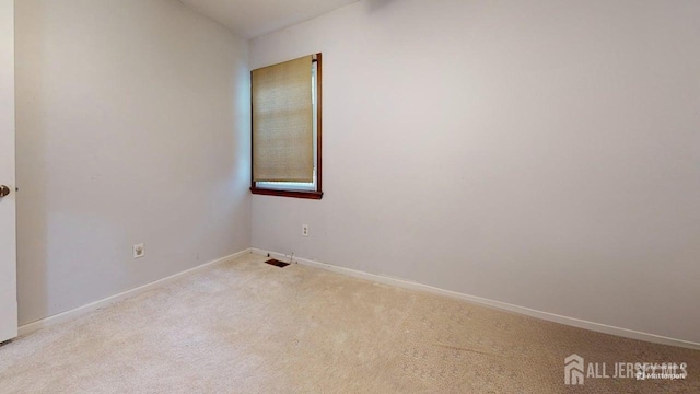 496 Calvert Rd, North Brunswick, NJ 08902 - unfurnished room featuring carpet floors and baseboards