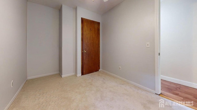 496 Calvert Rd, North Brunswick, NJ 08902 - unfurnished bedroom featuring light carpet, baseboards, and a closet