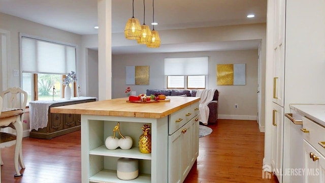 496 Calvert Rd, North Brunswick, NJ 08902 - kitchen featuring wood counters, wood finished floors, healthy amount of natural light, recessed lighting, and pendant lighting