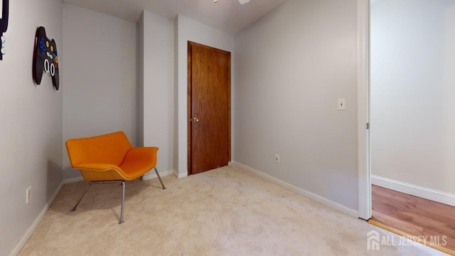 496 Calvert Rd, North Brunswick, NJ 08902 - sitting room with carpet floors and baseboards