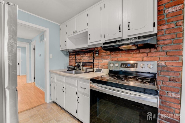 117 Burlington Ave, Leonardo, NJ 07737 - kitchen with appliances with stainless steel finishes, under cabinet range hood, a sink, white cabinetry, and light countertops