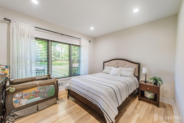 bedroom with light wood-type flooring