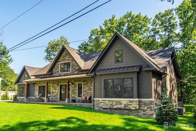 craftsman-style home featuring a porch and a front lawn