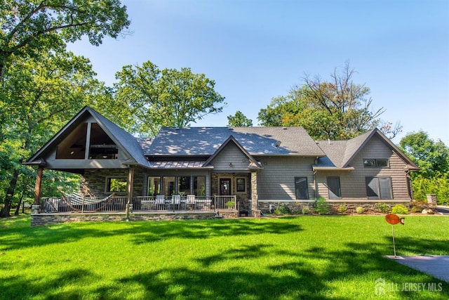 rear view of house with a yard