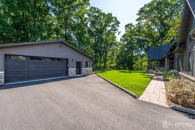 garage featuring a lawn