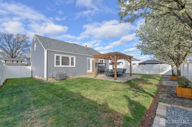 117 Whitman St, Carteret, NJ 07008 - rear view of property featuring a patio, a shingled roof, a pergola, a yard, and a fenced backyard