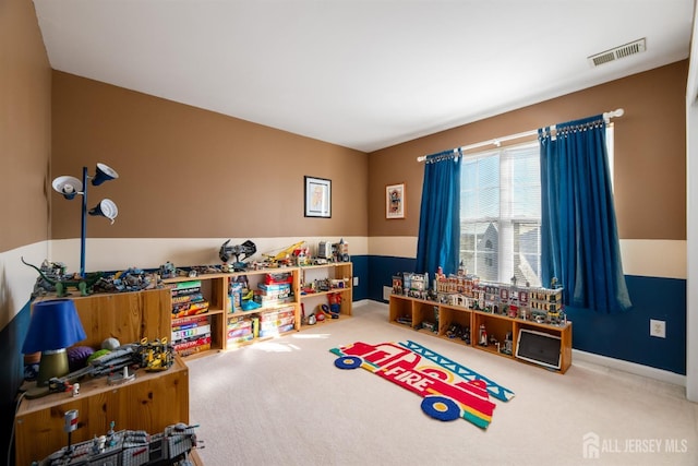 recreation room with carpet flooring