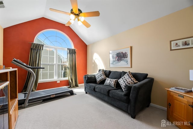 carpeted living room with vaulted ceiling and ceiling fan