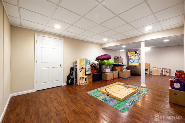 recreation room with a drop ceiling and wood-type flooring