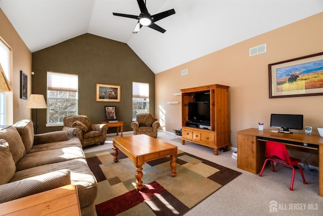 carpeted living room featuring ceiling fan and high vaulted ceiling