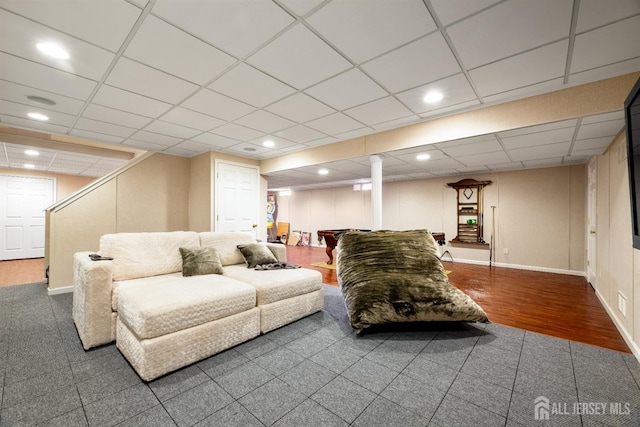 living room with hardwood / wood-style flooring and a drop ceiling