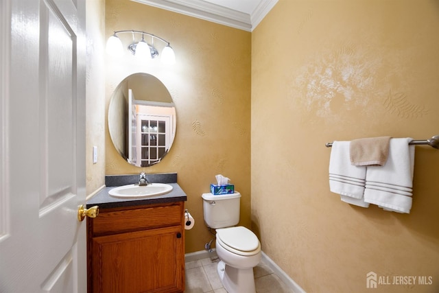 bathroom featuring vanity, ornamental molding, tile patterned floors, and toilet