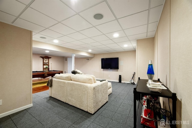 living room with a paneled ceiling and billiards