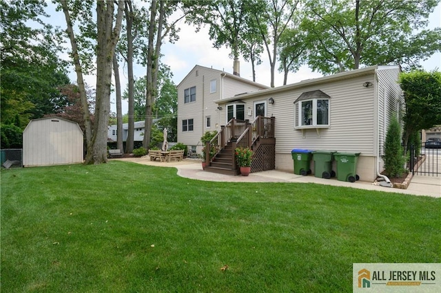 120 Alfred St, Edison, NJ 08820 - back of property featuring a storage shed, a patio, stairway, and a wooden deck