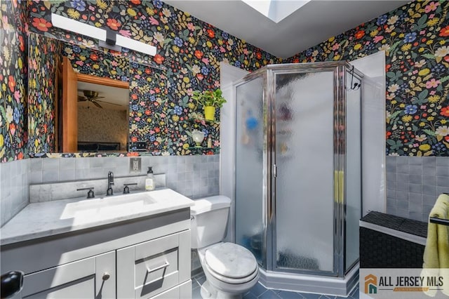 120 Alfred St, Edison, NJ 08820 - bathroom featuring wallpapered walls, tile walls, vanity, a shower stall, and tile patterned floors
