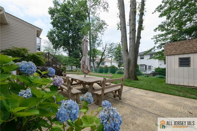 120 Alfred St, Edison, NJ 08820 - view of patio / terrace with a storage unit, outdoor dining area, and stairs