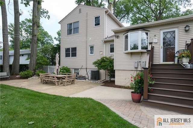 120 Alfred St, Edison, NJ 08820 - rear view of house with a patio area