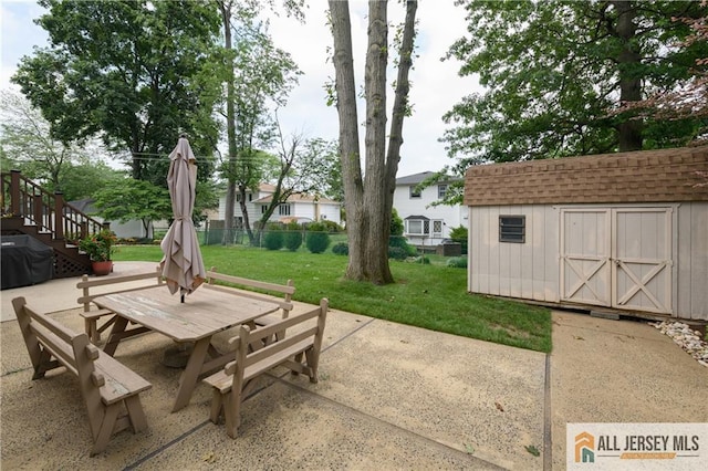 120 Alfred St, Edison, NJ 08820 - view of patio featuring outdoor dining space, a storage unit, and grilling area