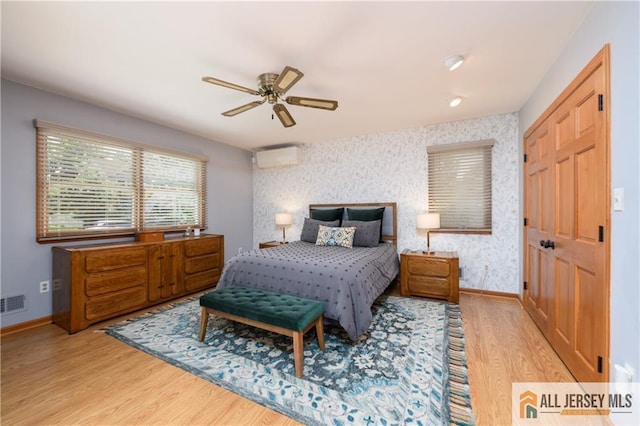 120 Alfred St, Edison, NJ 08820 - bedroom featuring wood finished floors, wallpapered walls, a wall unit AC, and a ceiling fan
