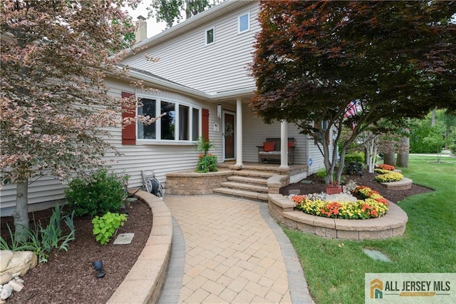 120 Alfred St, Edison, NJ 08820 - view of front of property featuring a chimney, a front yard, and a porch