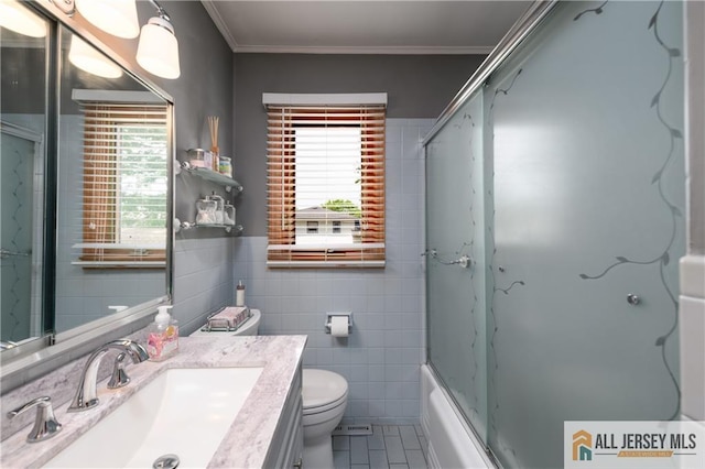 120 Alfred St, Edison, NJ 08820 - full bathroom with tile walls, tile patterned flooring, vanity, healthy amount of natural light, and bath / shower combo with glass door