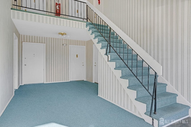 529 Sharon Garden Ct, Woodbridge Proper, NJ 07095 - staircase featuring wallpapered walls and carpet floors