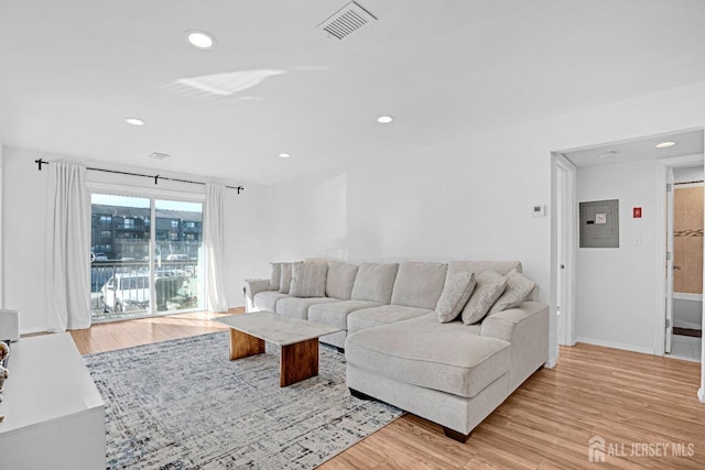 529 Sharon Garden Ct, Woodbridge Proper, NJ 07095 - living area with light wood-style floors, recessed lighting, and electric panel