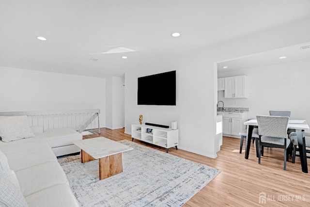 529 Sharon Garden Ct, Woodbridge Proper, NJ 07095 - living room featuring light wood-style flooring and recessed lighting