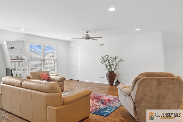 living room with recessed lighting, ceiling fan, and light wood-style floors