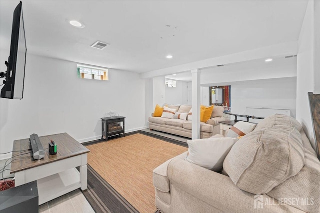 living room with recessed lighting, baseboards, and visible vents