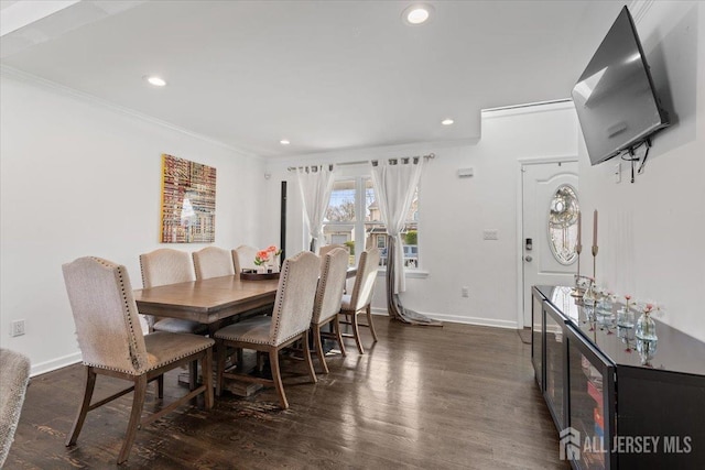 dining room featuring recessed lighting, ornamental molding, baseboards, and dark wood-type flooring