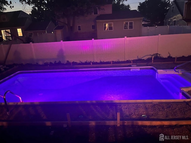 view of pool featuring a fenced in pool and a fenced backyard