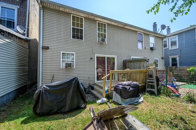 back of house with cooling unit, fence, and a wooden deck