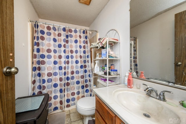 full bath with a shower with curtain, toilet, a textured ceiling, stone tile flooring, and vanity