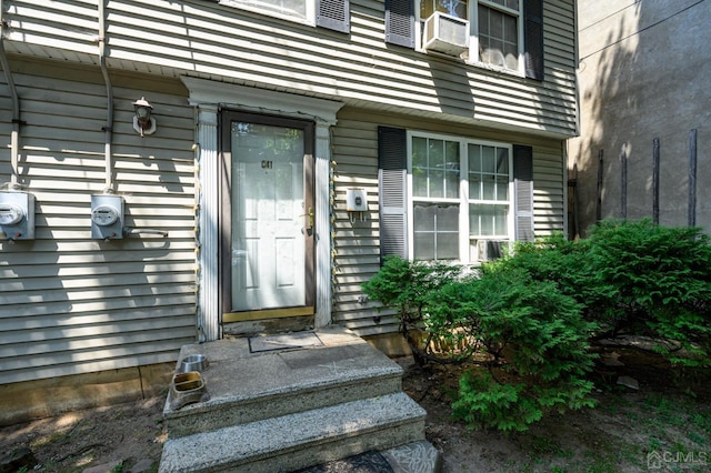 view of exterior entry featuring cooling unit