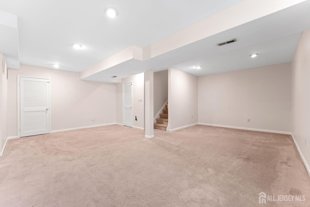 26 Allison Ct, South Brunswick, NJ 08852 - finished basement featuring light colored carpet, baseboards, stairs, and recessed lighting