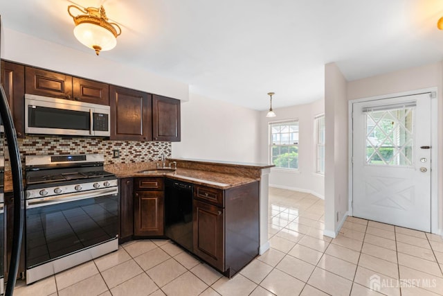 26 Allison Ct, South Brunswick, NJ 08852 - kitchen featuring stainless steel appliances, decorative backsplash, a peninsula, and dark brown cabinetry