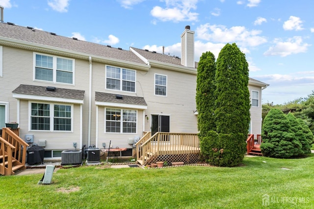 26 Allison Ct, South Brunswick, NJ 08852 - back of house featuring a chimney, a deck, a lawn, roof with shingles, and central AC