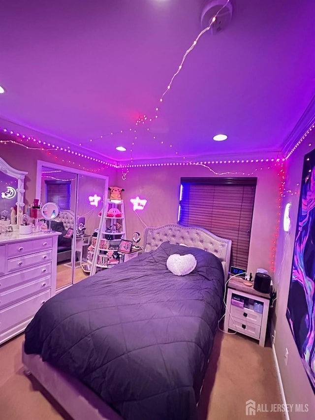 carpeted bedroom with recessed lighting and crown molding