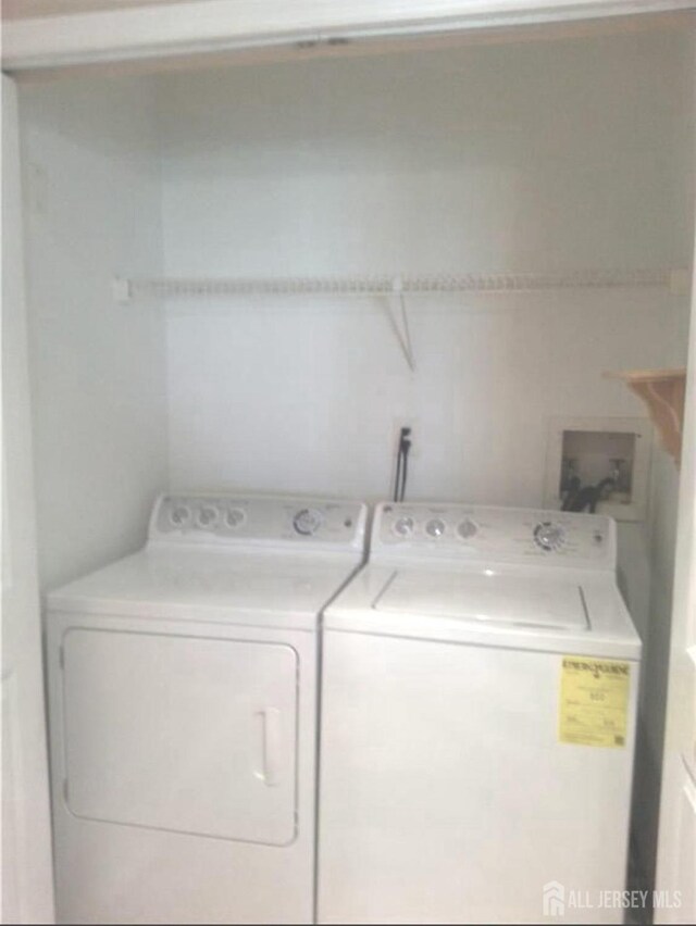 laundry area with separate washer and dryer