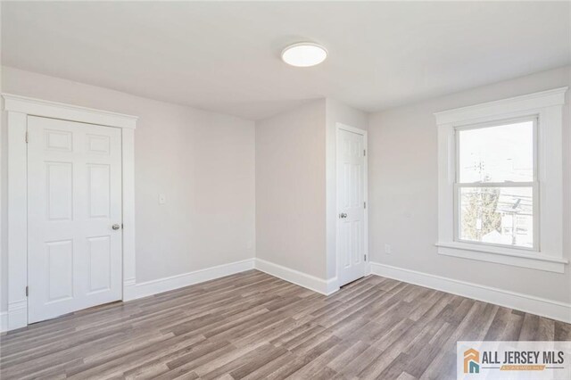 spare room featuring light hardwood / wood-style floors