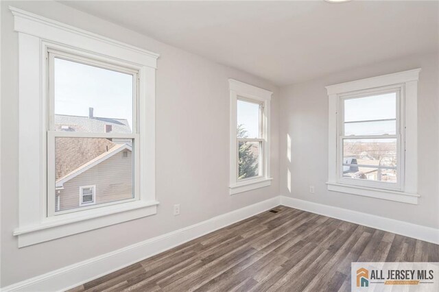 empty room featuring hardwood / wood-style floors