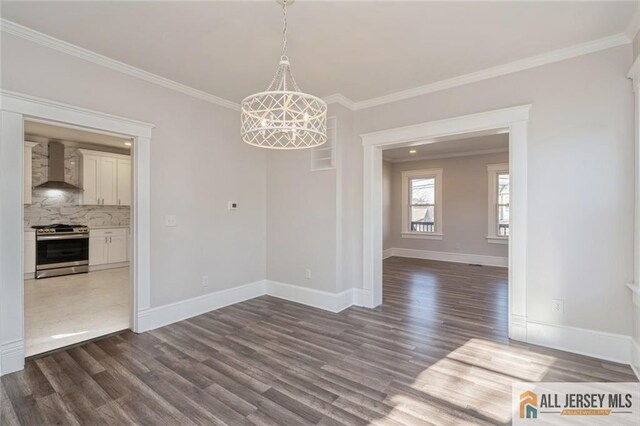 unfurnished dining area featuring crown molding and dark hardwood / wood-style floors