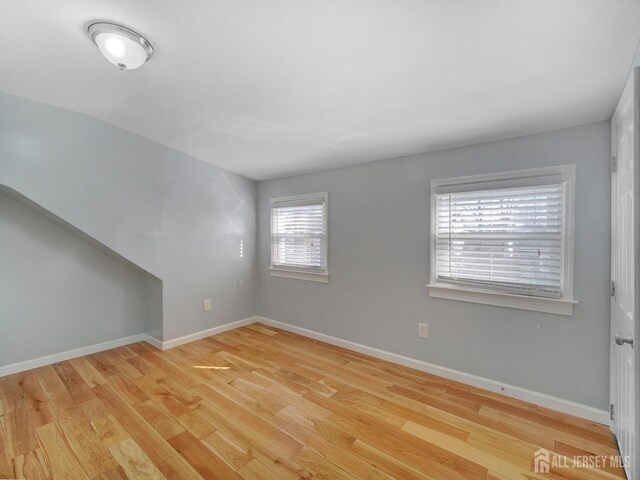 empty room with light hardwood / wood-style floors