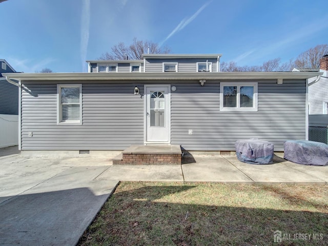 rear view of house with a patio