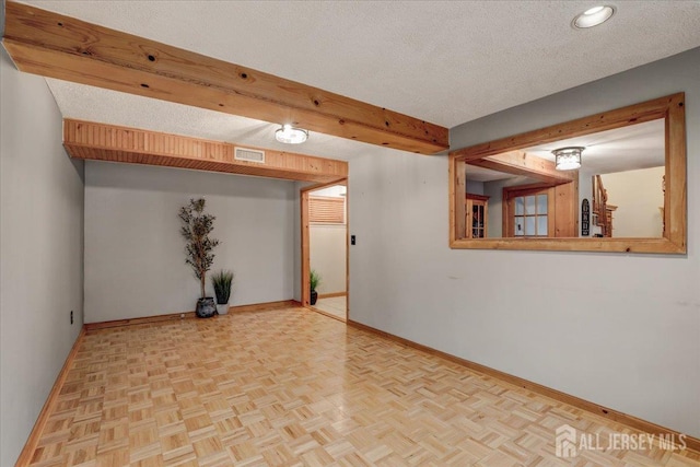 12 Euclid Rd, South Amboy, NJ 08879 - empty room featuring a textured ceiling and beamed ceiling